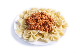 Farfalle bolognese pasta with minced meat isolated on white background. close up