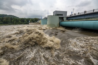 Weir of the Lake Baldeney in Essen, the masses of water roar through the open weirs, high water on