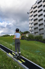 CopenHill, waste incineration plant and artificial ski slope, skiing with a view of the ski lift,