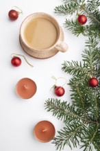 Christmas or New Year composition. Decorations, red balls, fir and spruce branches, cup of coffee,