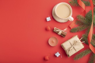 Christmas or New Year composition. Decorations, box, cinnamon, fir and spruce branches, cup of