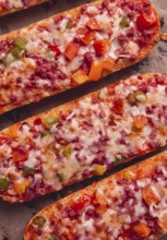 Pizza on a baguette, top view, close-up, no people, fast food, street food