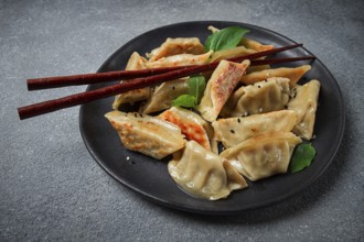 Japanese fried dumplings, gyoza, sesame seeds, top view, no people