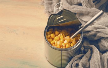 Open tin can, with corn, top view, selective focus, no people, close-up