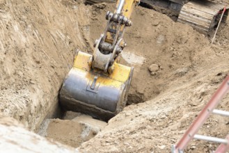 Working excavator tractor digging A trench