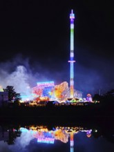 Rhine-Herne Canal with the Cranger Kirmes at night on the other side of the canal, Herne, Ruhr