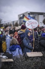 150, 000 people gather around the Bundestag in Berlin to build a human wall against the shift to