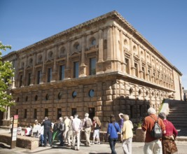 Tour group of tourists outside the Palacio de Carlos V, Palace of King Charles the Fifth, the