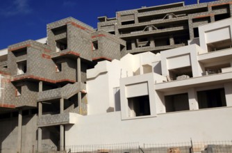 Concrete shells of uncompleted housing in the Castillo development, Caleta de Fuste, Fuerteventura,