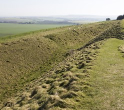 Defensive ditch and rampart at Barbury Castle Country Park, Iron Age hill fort, Wiltshire, England,