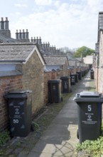 Rubbish bins in back alley of nineteenth century model worker's housing, Railway Village Swindon,