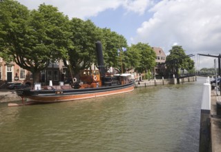 Historic boats and buildings in Wolwevershaven, Dordrecht, Netherlands