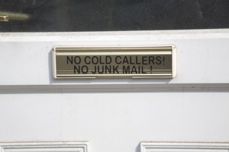 Notice on house letter box 'No cold callers no junk mail, UK