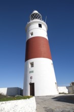 Red and white striped lighthouse at Europa Point, Gibraltar, British terroritory in southern Spain,