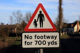 Sign in village for No footway for 700 yards, Shottisham, Suffolk, England, UK