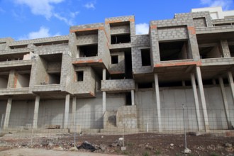 Concrete shells of uncompleted housing in the Castillo development, Caleta de Fuste, Fuerteventura,