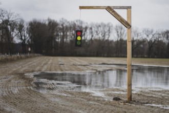 A gallows with a symbolic traffic light stands in a field near Gablenz, 14 Jan. 2024. As part of