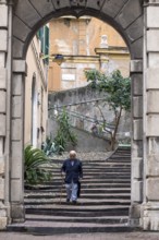 Elderly gentleman on a staircase in the historic centre, Genoa, Italy, Europe