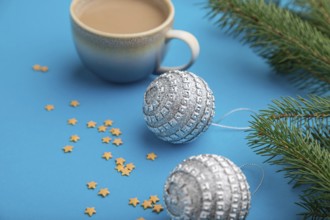 Christmas or New Year composition. Decorations, silver balls, fir and spruce branches, cup of