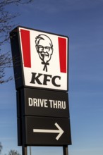 Banner sign Colonel Sanders advertising KFC Kentucky Fried Chicken Drive Thru outlet, Martlesham,