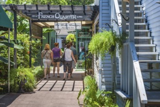 Women walking into the French Quarter shopping area in downtown Fairhope, Alabama, USA, North