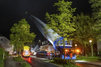 Transport of a 68 metre long, 22 tonne blade of a wind turbine, here in Breckerfeld-Waldbauer, with