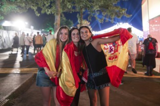 Fans of the Spanish team pose after the 2:1 victory against England at the Adidas fan zone at the