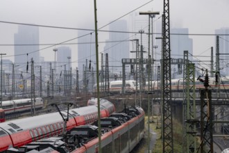 Railway tracks with regional and long-distance trains, ICE, after freezing rain, in front of