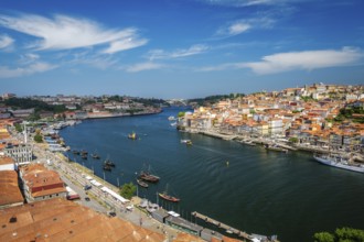 Aerial view of Porto city and Vila Nova de Gaia and Douro river with moored sailling ship from Dom