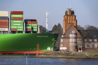 Container ship Ever Gifted, enters the port of Hamburg on the Elbe, shipping company Evergreen,