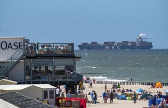 Beach of Domburg, in Zeeland, South Holland, Netherlands, in the background a container freighter