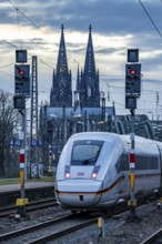 ICE train on the track in front of Cologne Central Station, Hohenzollern Bridge, Cologne Cathedral,