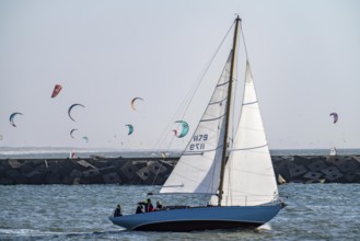 Sailing boat leaves the harbour of Scheveningen, Netherlands