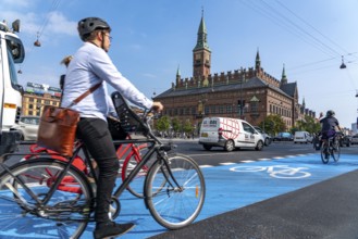 Cyclists on cycle paths, Radhuspladsen, City Hall Square, in the city centre of Copenhagen,