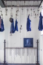 Changing room with pulleys and chains to hoist coal miners clothes at Le Bois du Cazier, coal