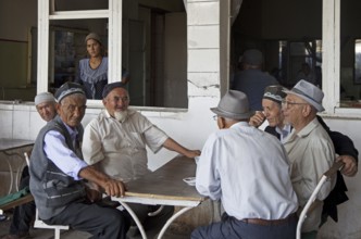 Kyrgyz elderly men wearing traditional tubeteikas in Osh, Kyrgyzstan, Asia