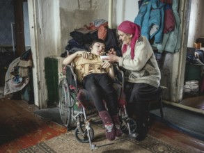 Lena, 70 years old, cares for her severely disabled granddaughter Lena, 18 years old. The family