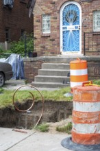 Detroit, Michigan, Workers replace old lead water service lines with copper pipes. Lead is harmful