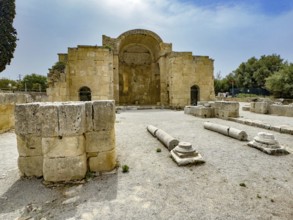 View of ancient ruins of Titus Basilica, in the foreground remains of stones foundation walls of