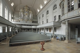 Interior view with organ, gallery, baptismal font and empty pews, St Gumbert's Church, Ansbach,