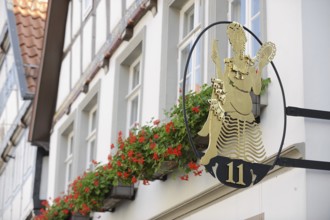 Nose sign with house number, Lemgo, North Rhine-Westphalia, Germany, Europe