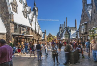 Park guests explore village of Hogsmeade in The Wizarding World of Harry Potter at Universal