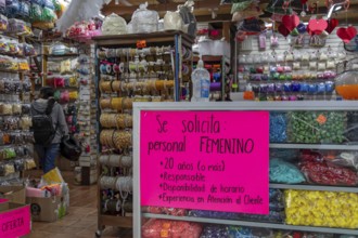 Oaxaca, Mexico, A help wanted sign in a store specifies that the store wants a woman, 20 years or