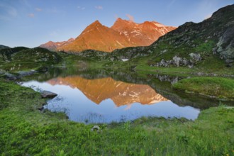 Chli Sustenhorn and Sustenhorn reflected in the Seebodensee, Canton Bern, Switzerland, Europe