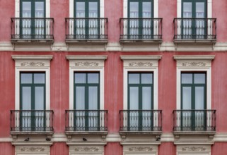 House façade with floor-to-ceiling windows and French balconies, Malaga, Andalusia, Spain, Europe