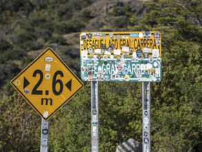 Stickers on name plate of suspension bridge Puente General Carrera, at lake Lago General Carrera,