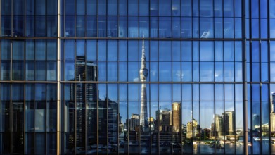 Glass surface facade mirroring an iconic skyline in evening light, AI generated