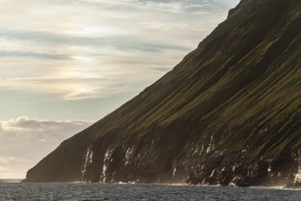 Steep green cliffs above the sea, sea spray, Vidareidi, Vidoy Island, Viðareiði, Viðoy Island,