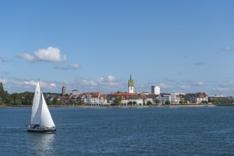 Cityscape, lakeside promenade, sailing boat, church tower, St. Nicholas Church, Friedrichshafen on