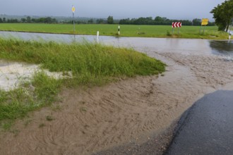 Heavy rain showers and thunderstorms pass over Possendorf in the Eastern Ore Mountains. Flooded